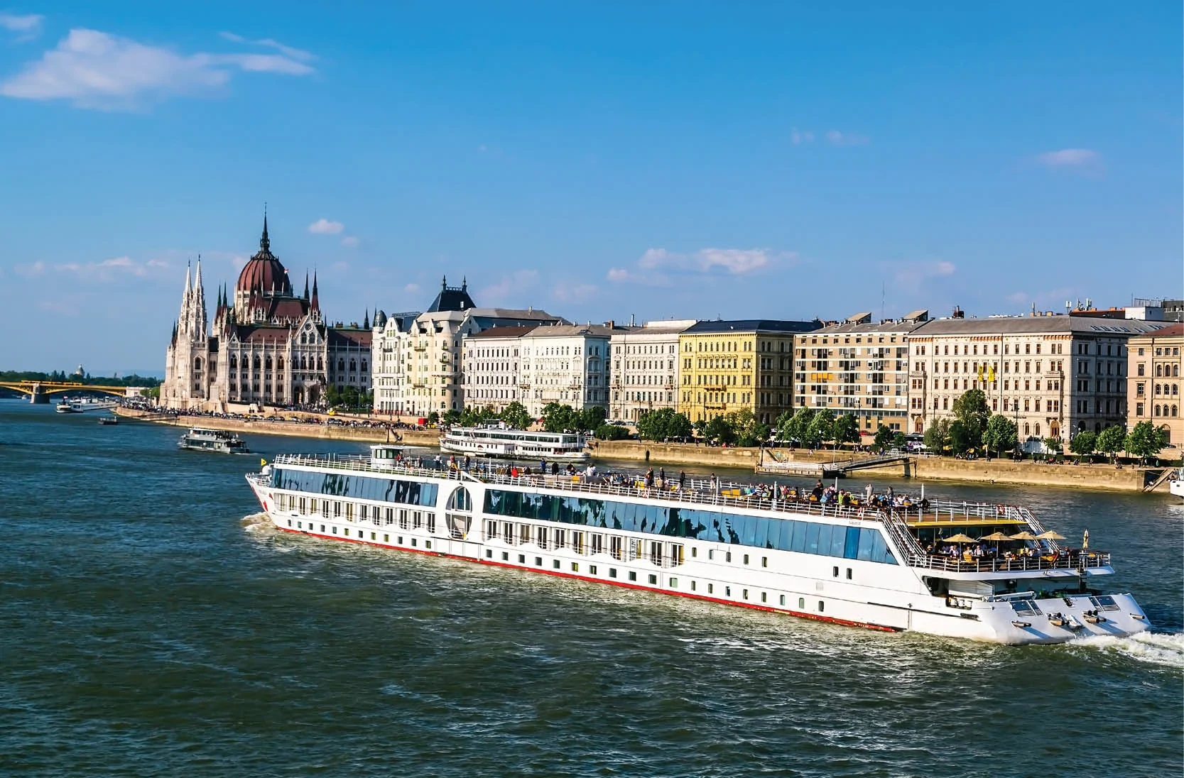 River cruise ship sailing past Budapest's riverfront