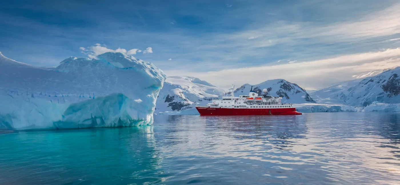 Expedition ship navigating among Antarctic ice