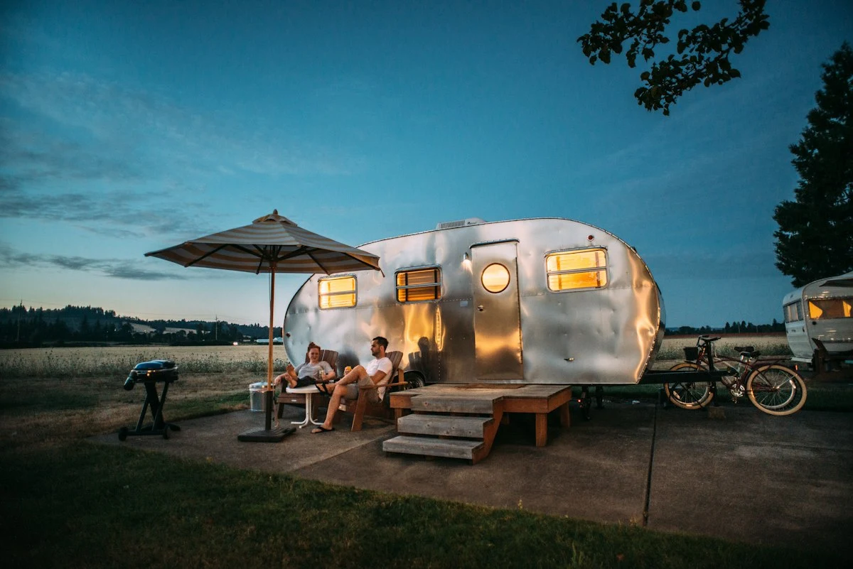 Remote camp beneath a wide evening sky