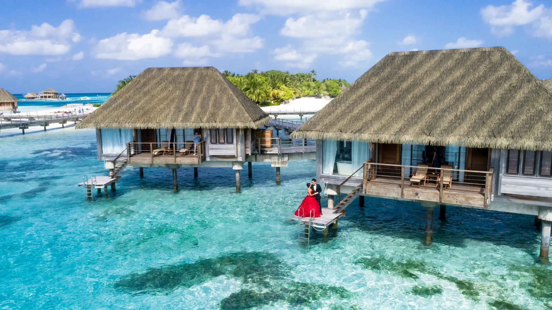 Overwater honeymoon villas in a turquoise lagoon