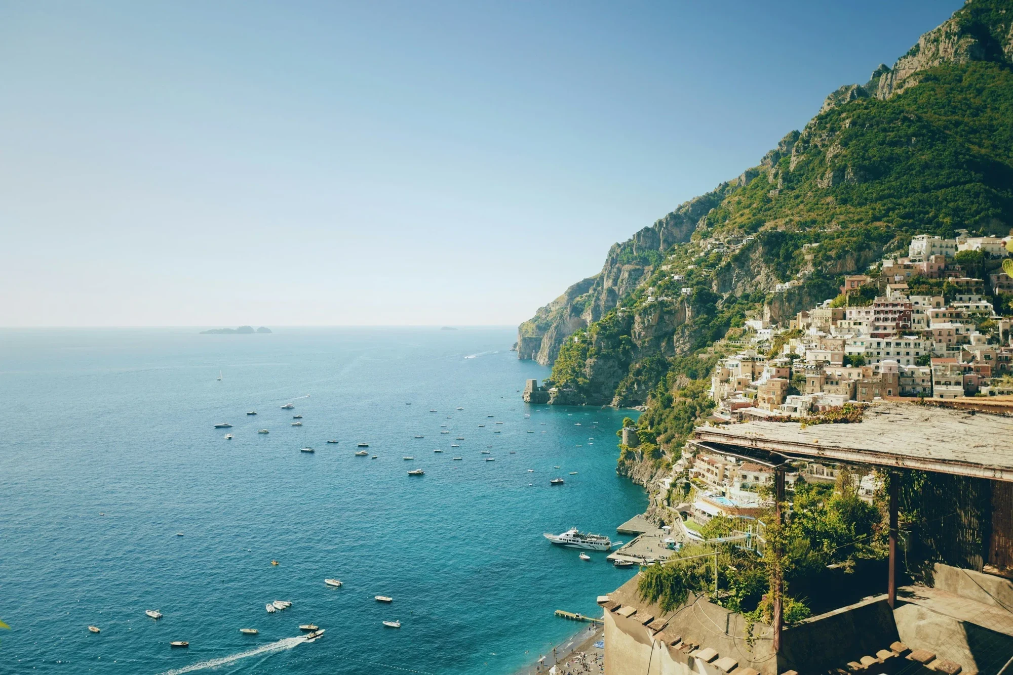 Sunlit Mediterranean coastline and hillside villages