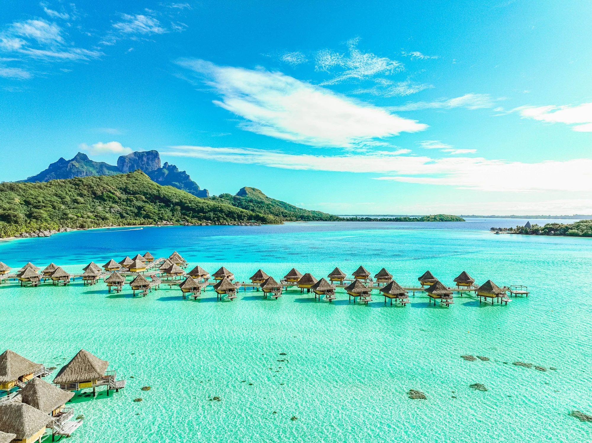 Bora Bora lagoon with overwater bungalows and Mount Otemanu
