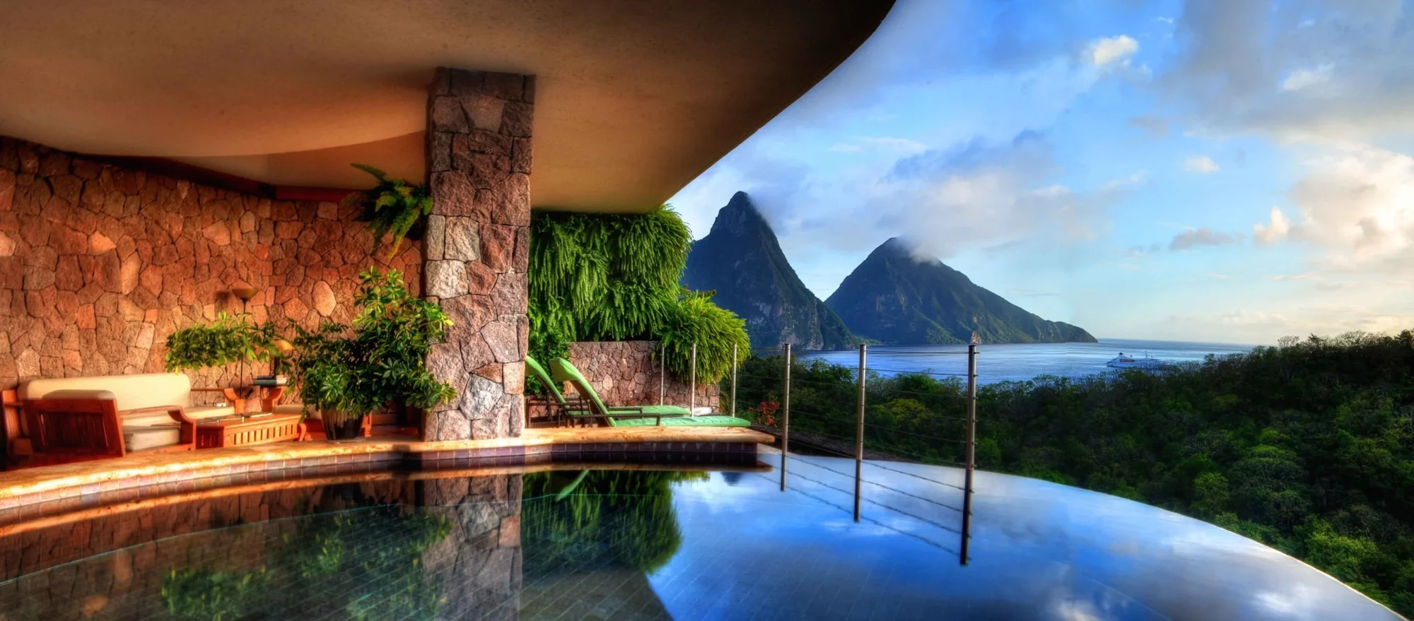 Pool overlooking a tropical mountain landscape
