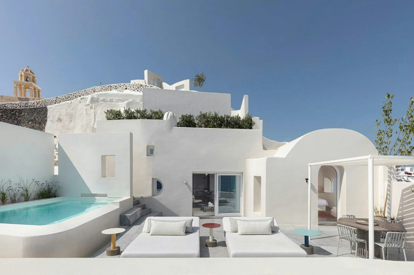Whitewashed caldera-view suite in Oia, Santorini