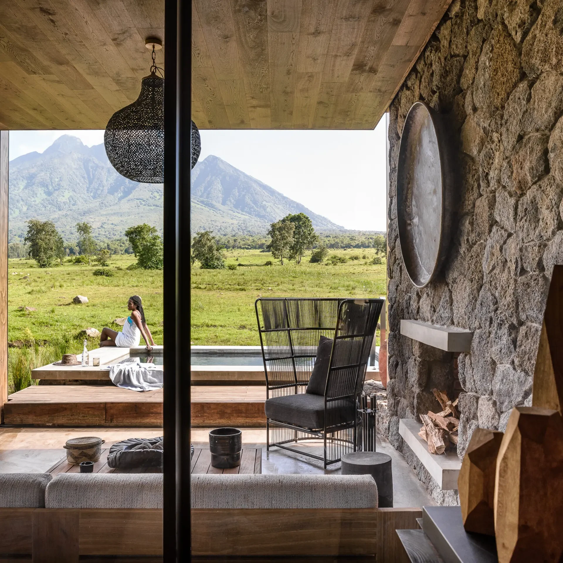 Lodge interior overlooking a volcanic landscape