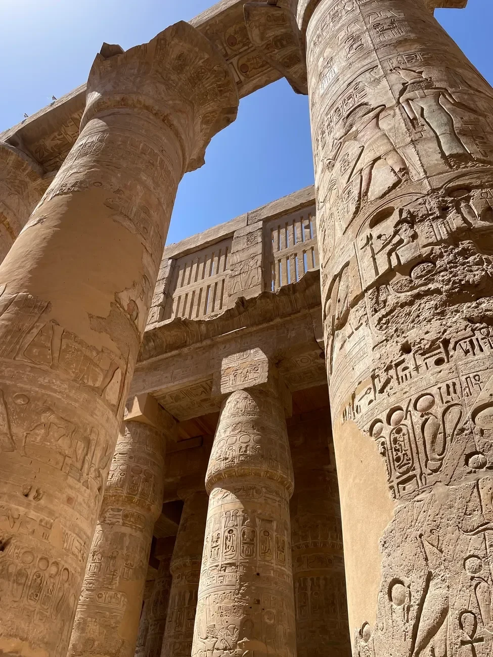 Ancient Egyptian temple columns in warm morning light