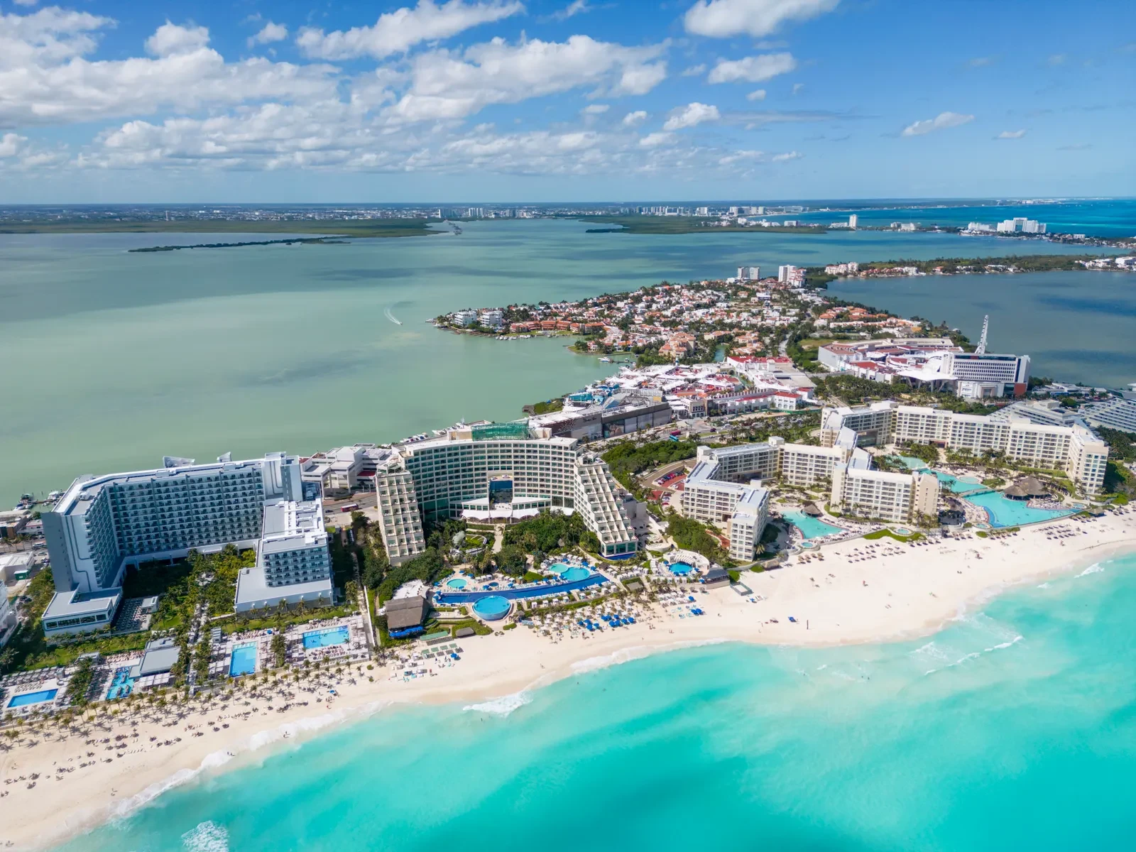 Aerial view of a beachfront resort and turquoise Caribbean water